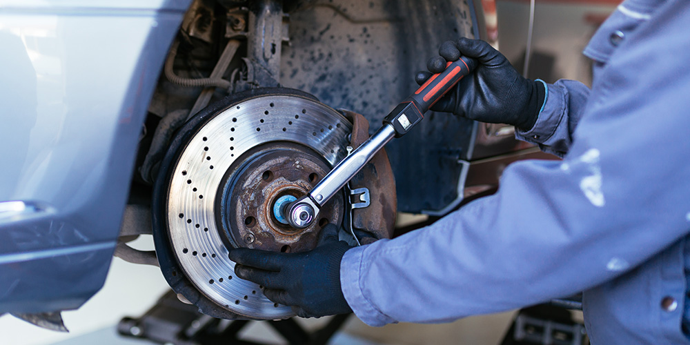 Image Of Mechanic Fixing Tire